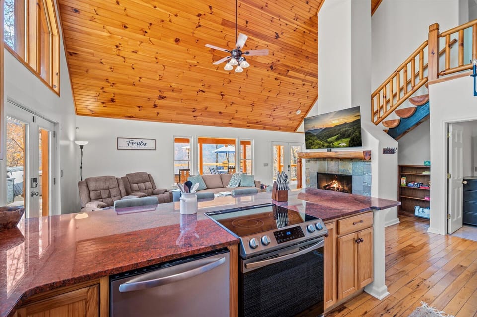 Full kitchen with ample cabinet space and large granite counters.