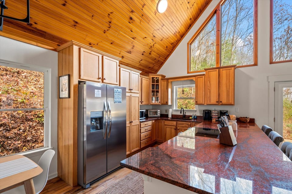 Well-equipped kitchen with modern stainless steel appliances.