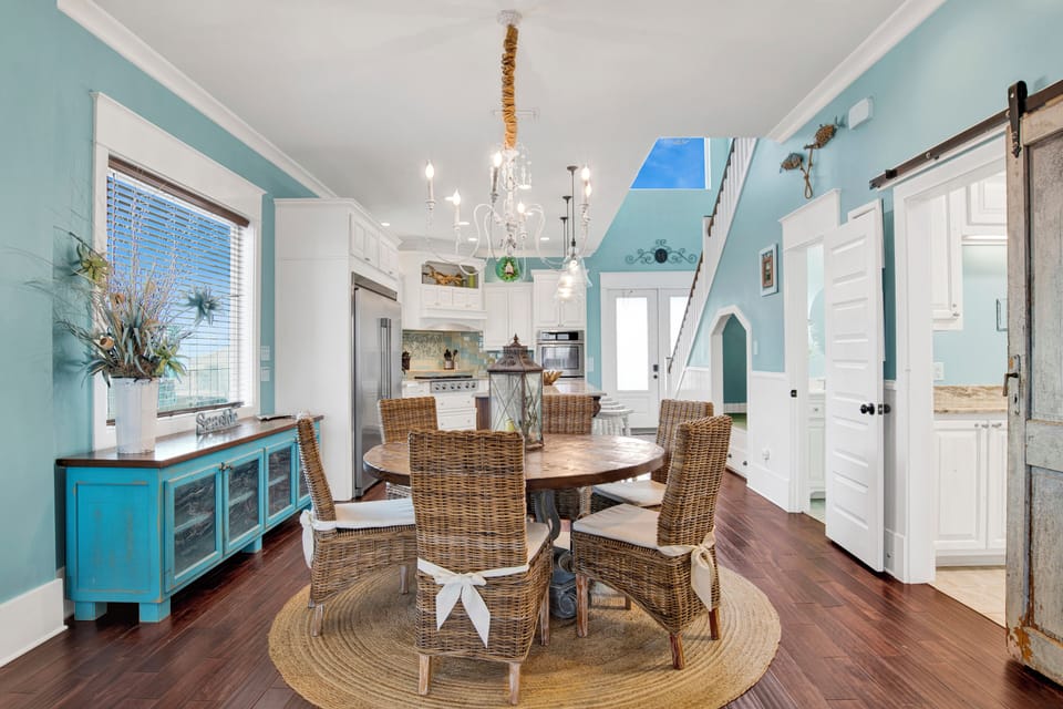 Dining table seats 6 with additional seating at the kitchen island