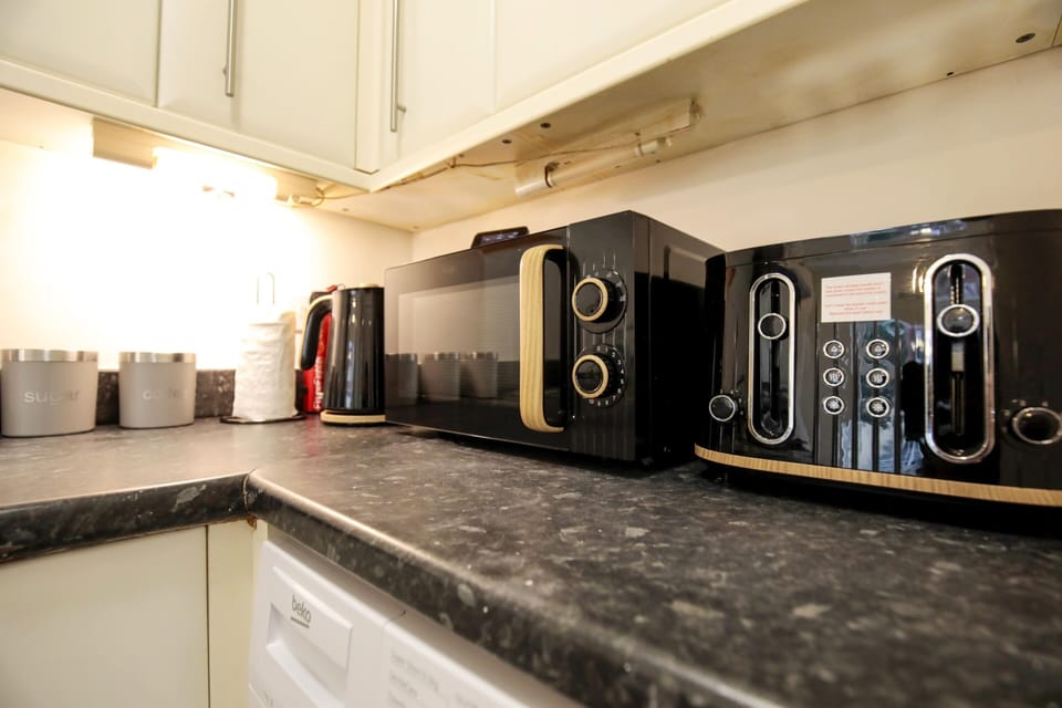Kitchen has Microwave, Kettle and Toaster. 