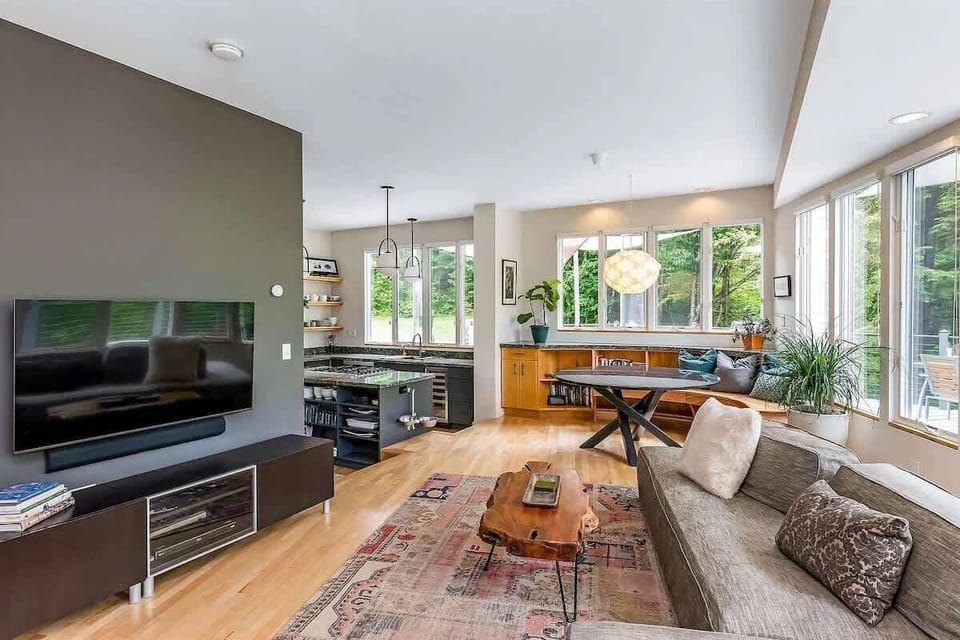 Living room with surround windows.