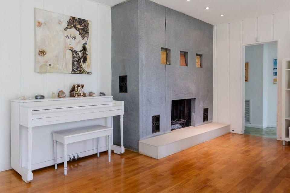 Bright dining space with seating for five, ideal for family meals or morning coffee with garden views.