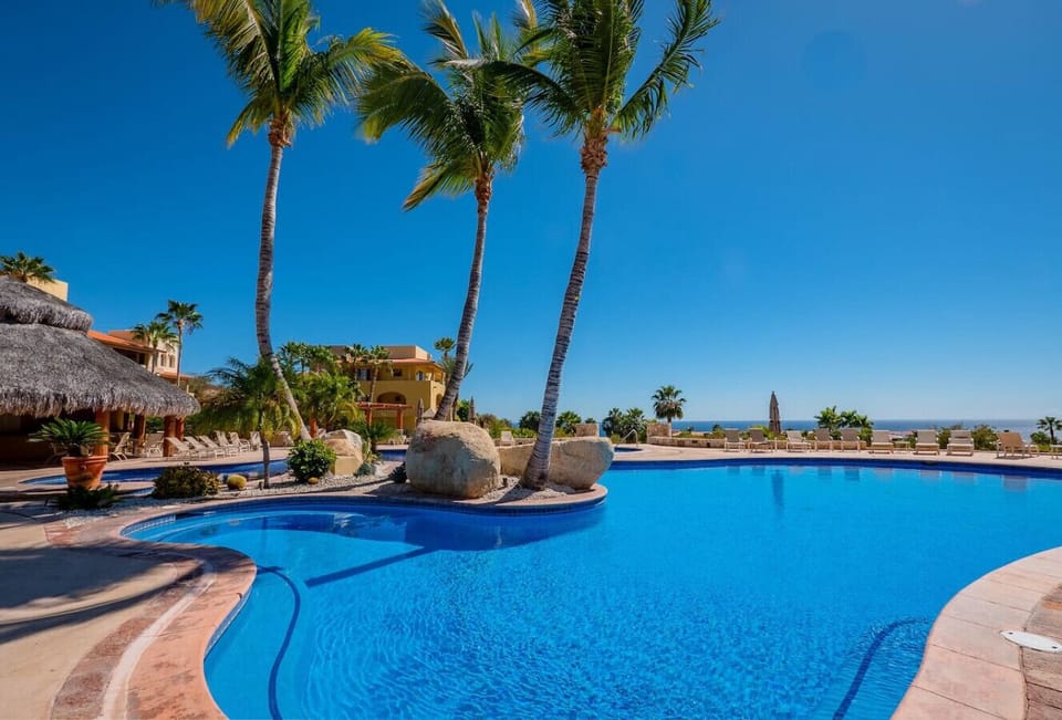 Enjoy the beautiful pool area, complete with a shady pergola and ocean views.
