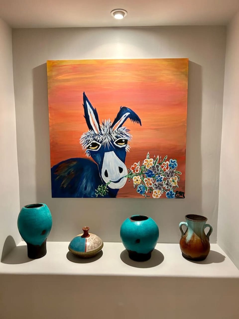 Unique local art adds color and personality to the space.