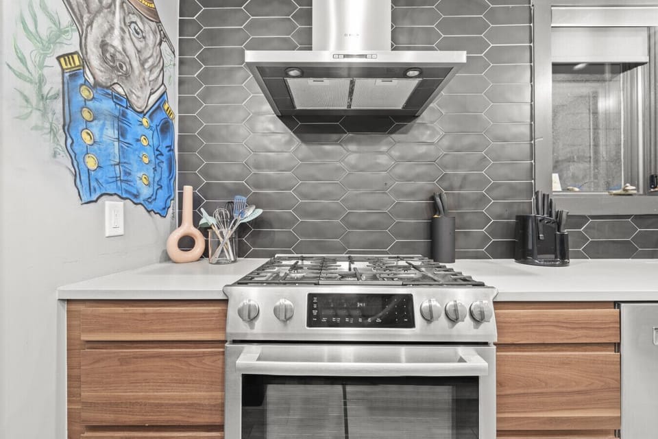 Cook and entertain in style with stainless steel appliances and quartz counters.