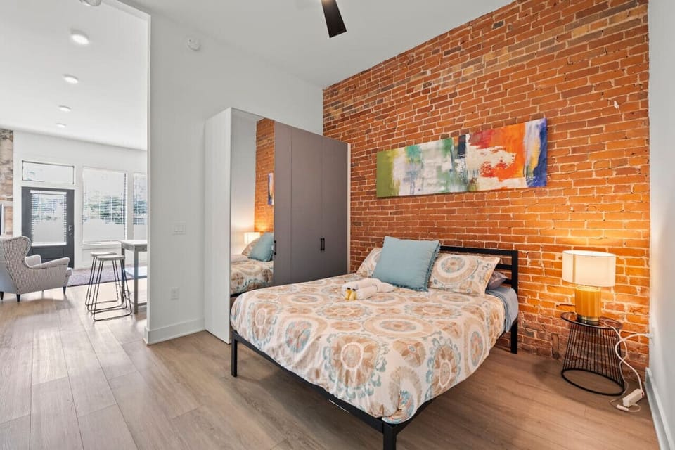 Our inviting bedroom features a luxurious bed for the perfect night`s sleep, complemented by a beautiful painting that enhances the ambiance.