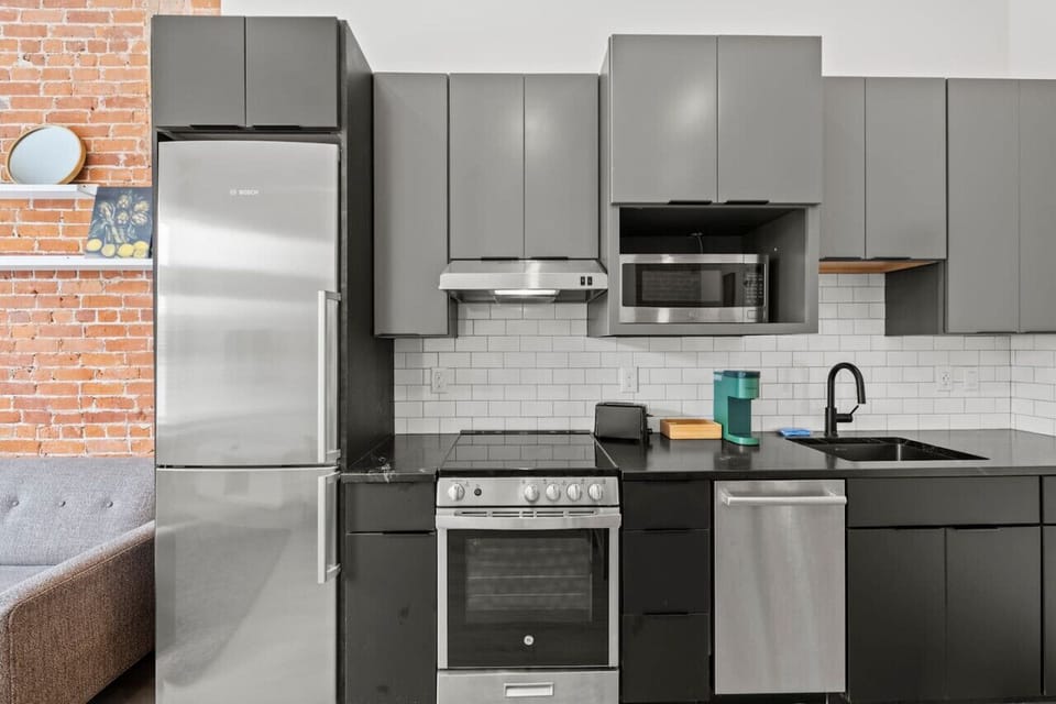 Our kitchen is equipped with sleek stainless steel appliances, perfect for whipping up your favorite meals.