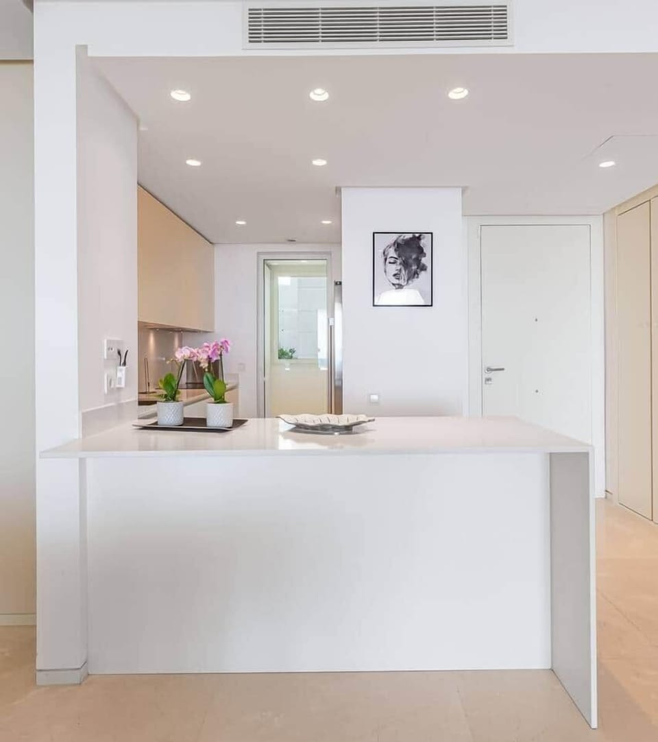 Fully equipped kitchen with modern appliances, washer and dryer.