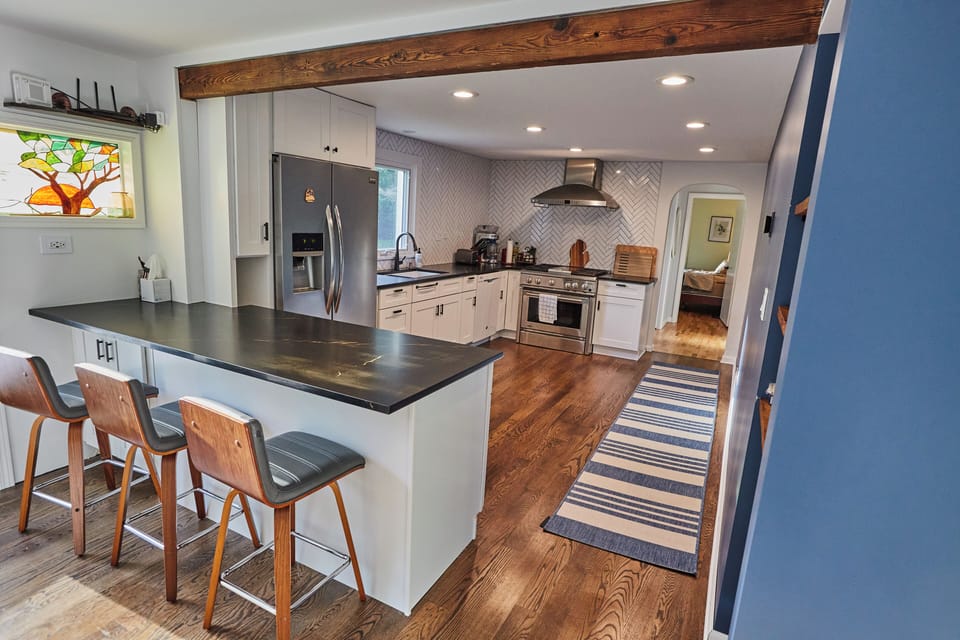 Main level kitchen with counter seating. 