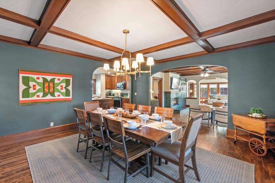 Spacious dining table set up to comfortably seat eight guests.