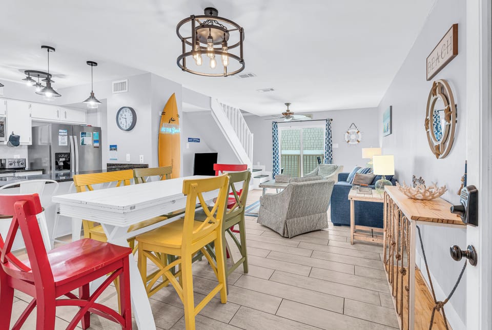 Enjoy bright coastal interiors and balcony access.