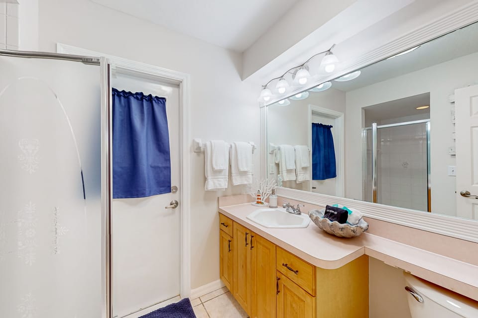 Bathroom features a step-in shower