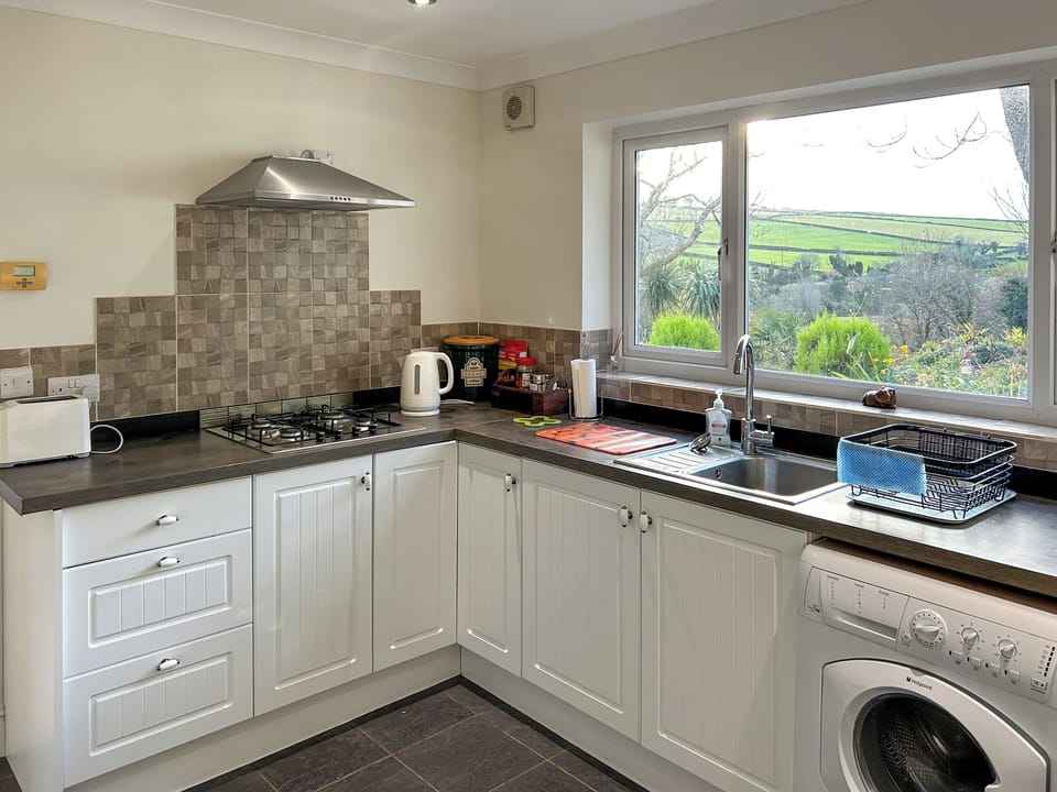 Kitchen/diner | At Cedar Lodge Apartment, Glen Mona, Isle of Man