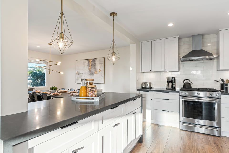 Modern kitchen with stainless steel appliances.