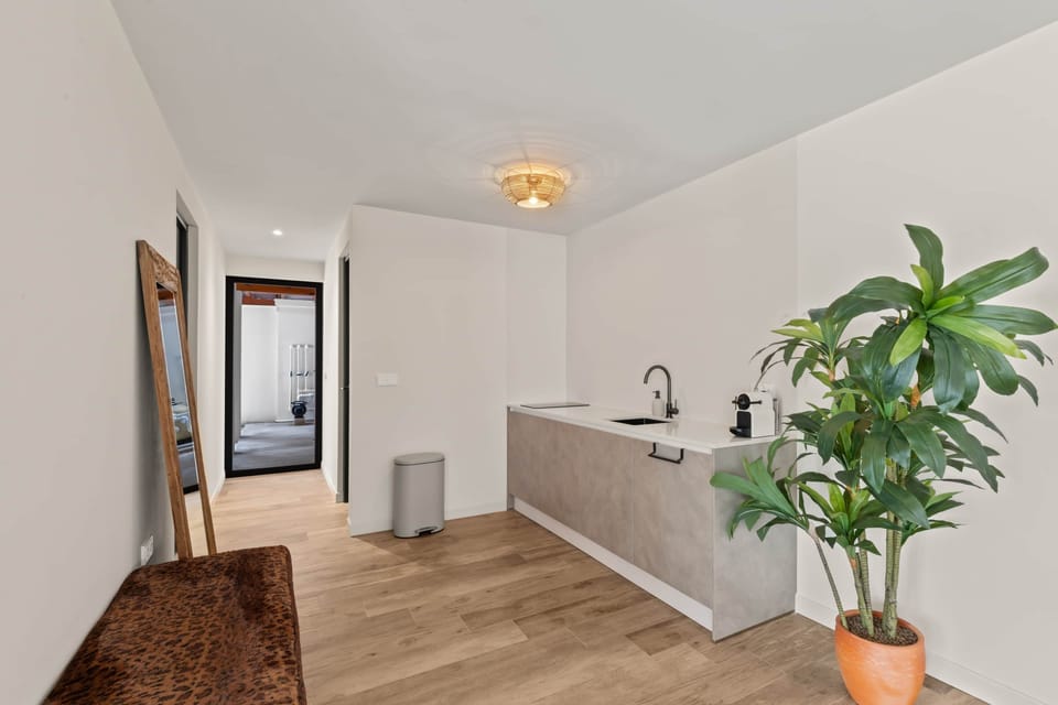 Kitchen with view of apartment entrance