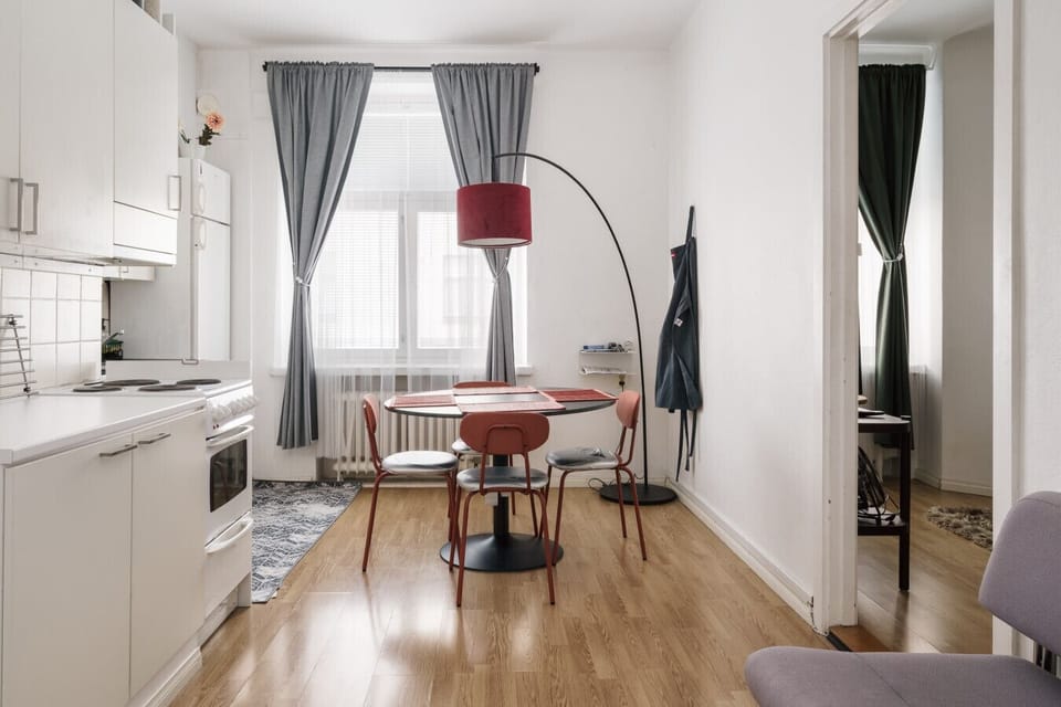 Cozy dining space for four, conveniently connected to the kitchen.