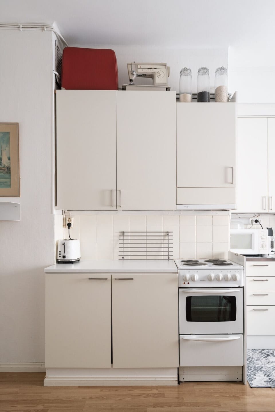 Kitchen equipped with a toaster for quick and convenient breakfasts.