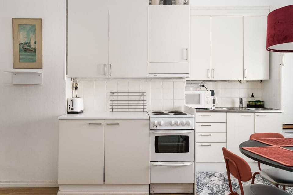 Bright, functional kitchen complete with cooking basics and utensils.