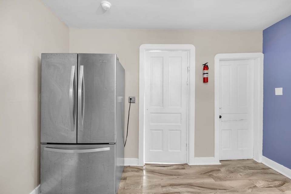 Your spacious kitchen features a sleek stainless steel refrigerator with ample storage for all your favorite snacks and meals during your stay.
