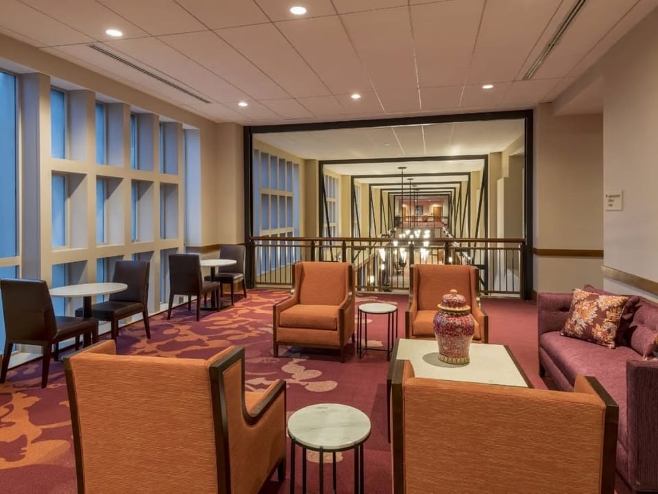 Gather with friends in a relaxed lounge with soft seating.