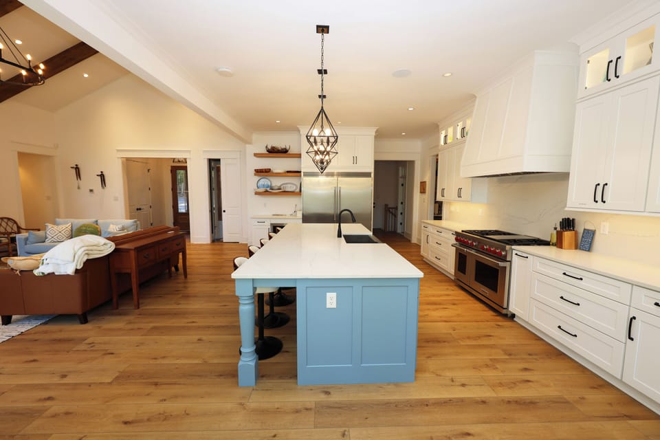Kitchen with chef's-level 48" Wolf dual range and cooktop