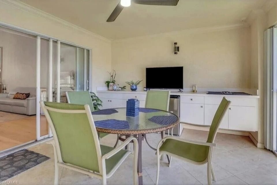 Lanai with outdoor electric grill and TV