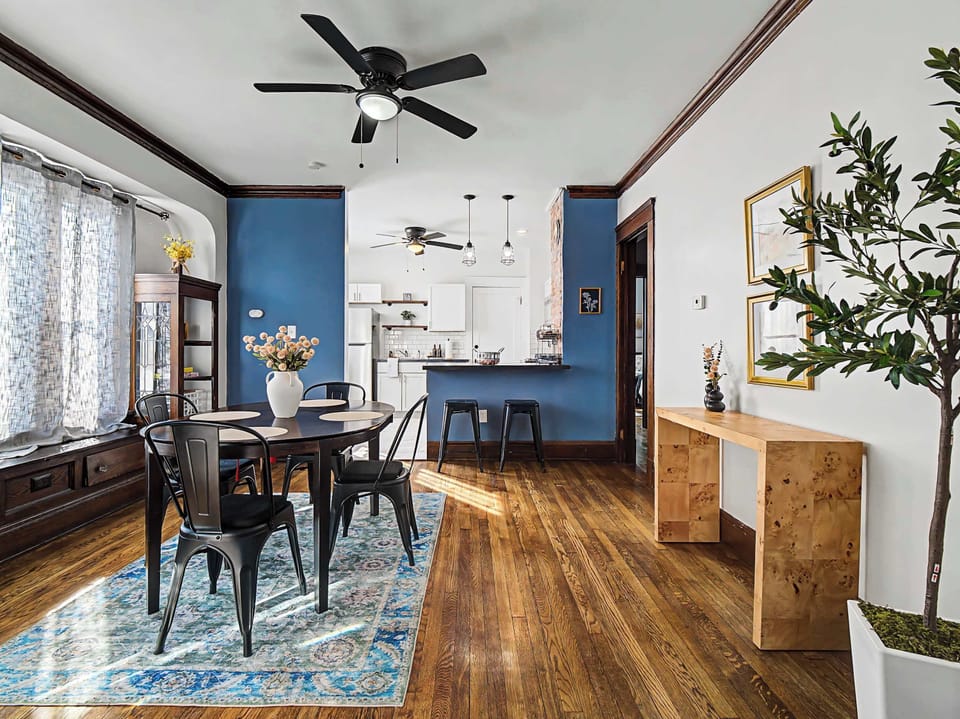 Open dining space w/ modern table & natural light