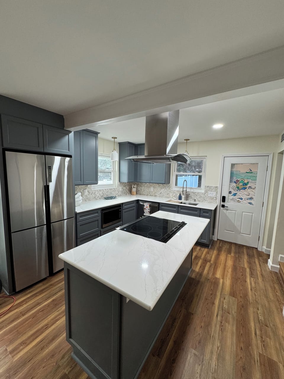 Kitchen with stove, fridge, microwave, dishwasher