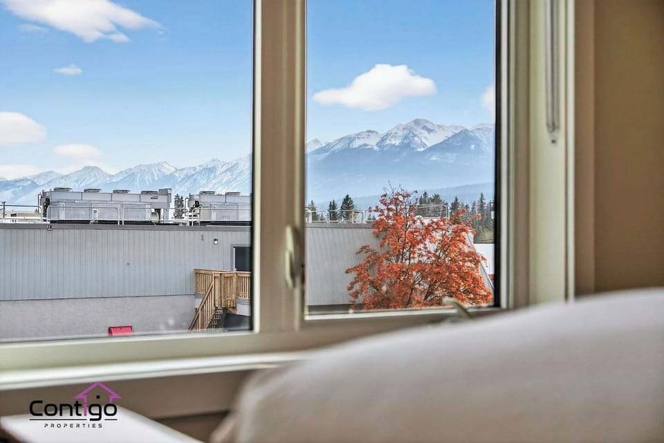 Fall asleep and wake up to sweeping panoramic views of Golden, BC`s iconic snow-capped mountain range — a breathtaking bedroom vista that makes every morning of your Kicking Horse Country vacation unforgettable.