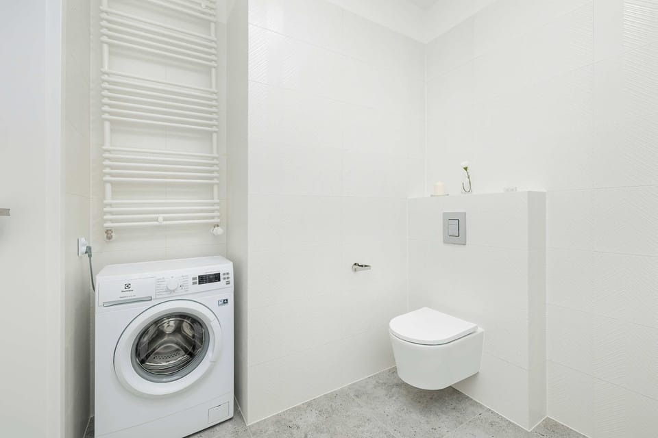 The bathroom's stylish design provides a relaxing environment. 