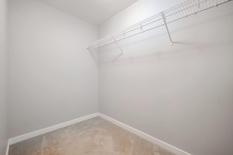 Large, well-sized closet designed to comfortably store clothing, or shoes.