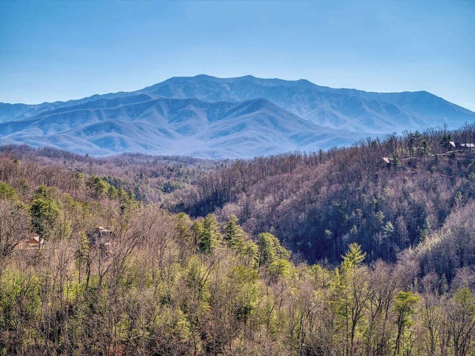 Take in breathtaking Smoky Mountain views from the expansive deck at Sassy Bear Hideaway.