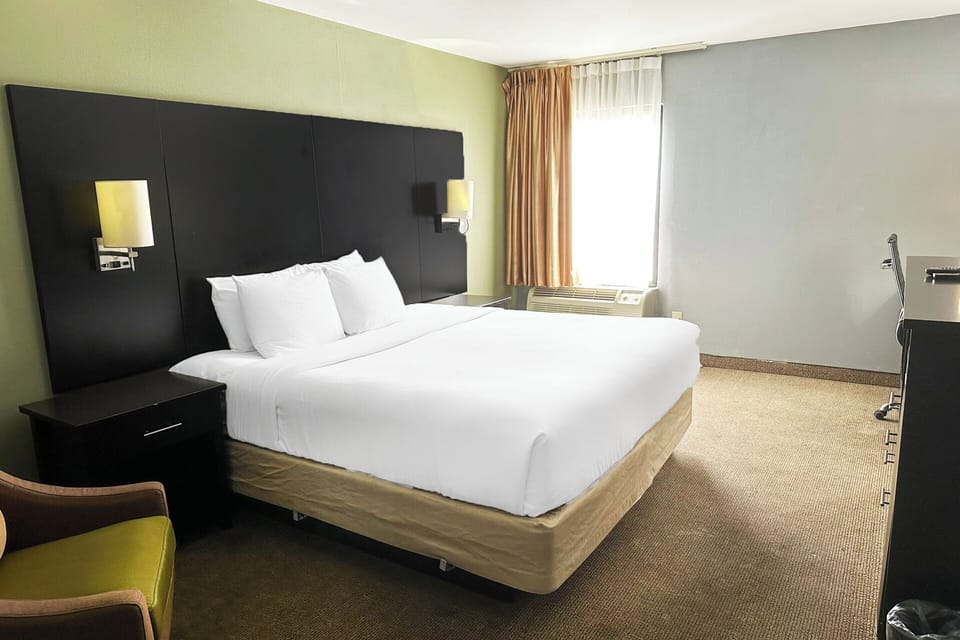 Settle into a comfortable king bed in a calm room.