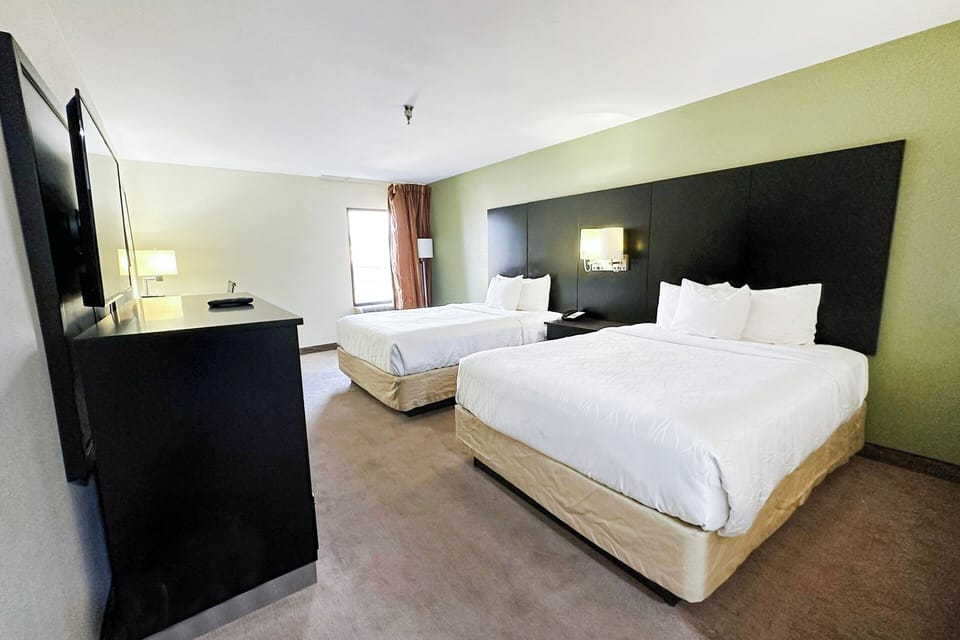 Stretch out comfortably in a bright room with two beds.