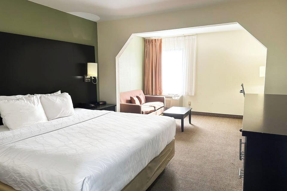 Relax in a spacious king room with cozy sitting nook.