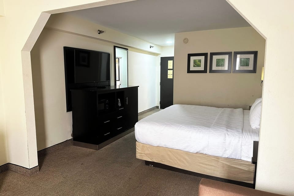 Recharge in a quiet king room with open, airy space.
