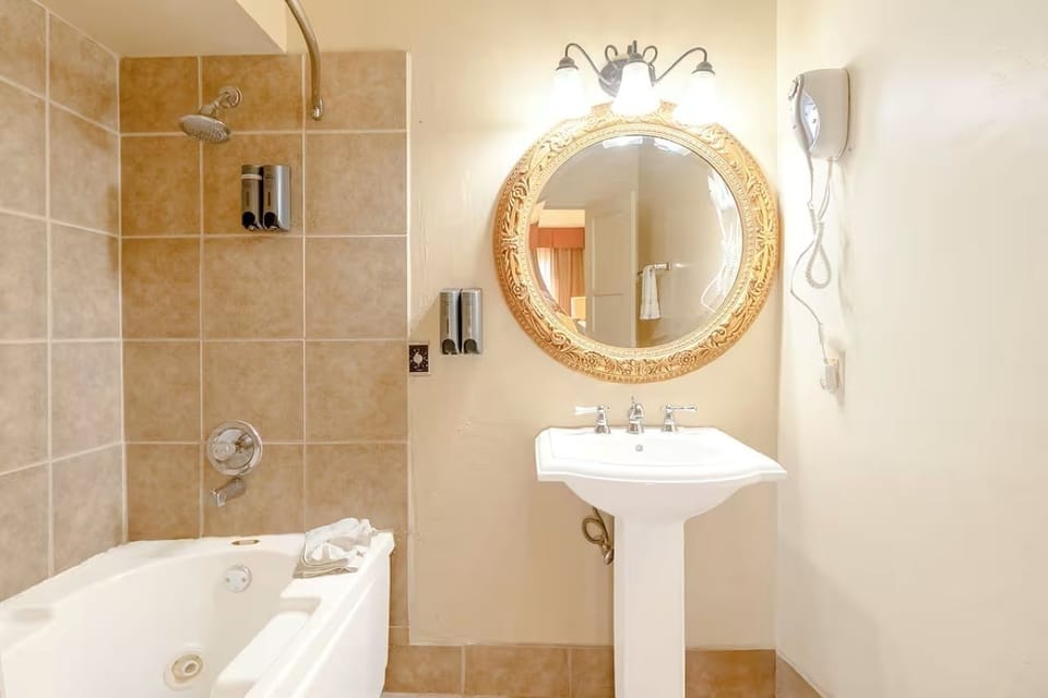 Refresh under warm lights with a deep soak and shower.