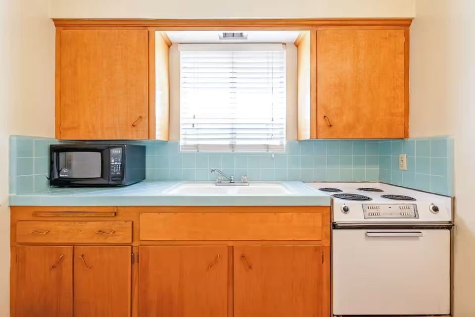 Prepare snacks anytime with a convenient kitchenette counter setup.