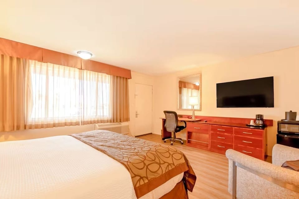 Settle in with a spacious work desk and big-screen TV.