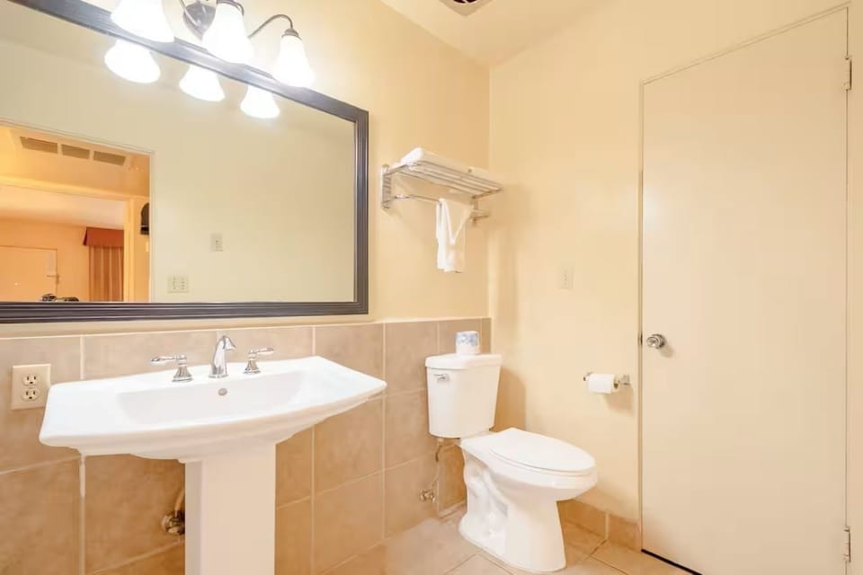 Feel at ease in a clean, well-lit bathroom layout.