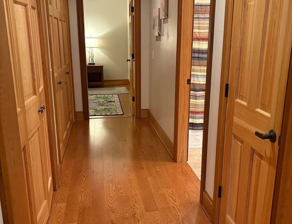 Lower level hallway with access to bedroom and bathroom
