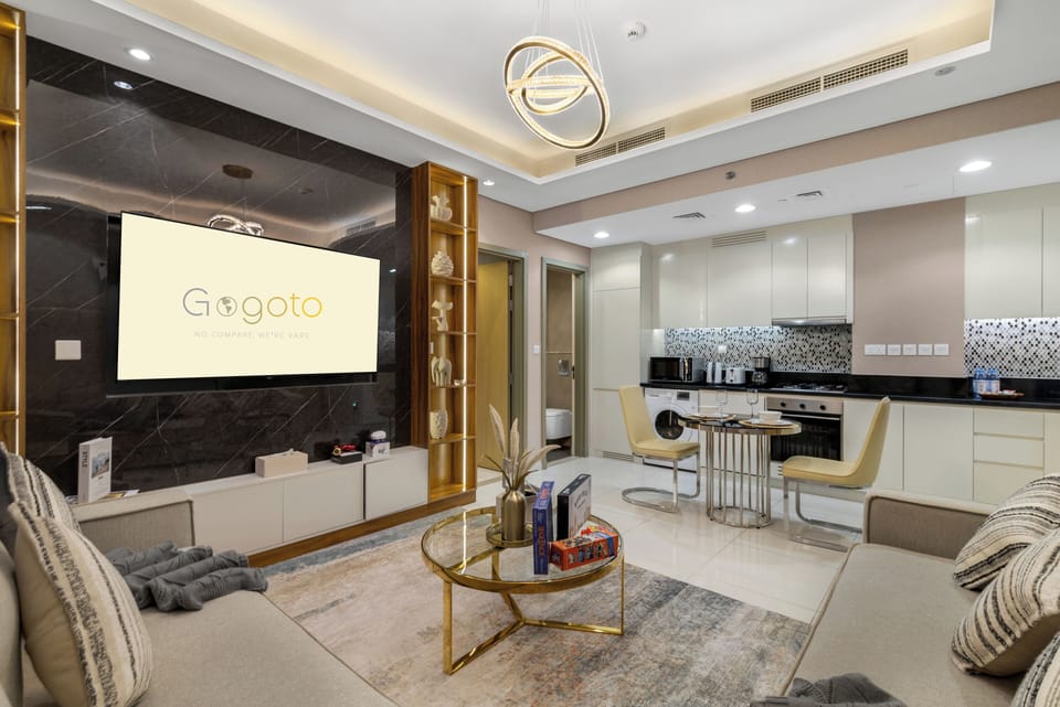 Spacious living room with comfy seating and city views.