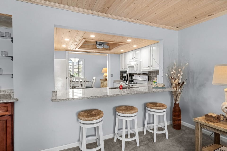 Modern kitchen with island and seating for three