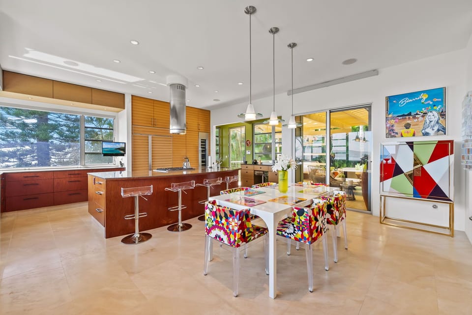 Share lively meals surrounded by color, light, and sweeping coastal scenery.