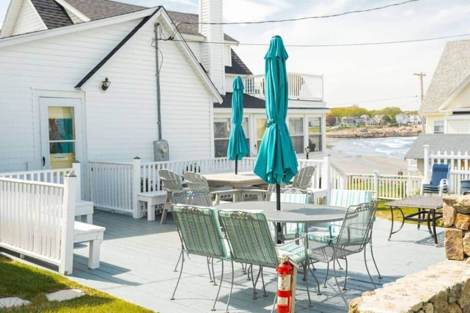 Large expansive deck with lots of places to hang out and enjoy the view of the ocean.