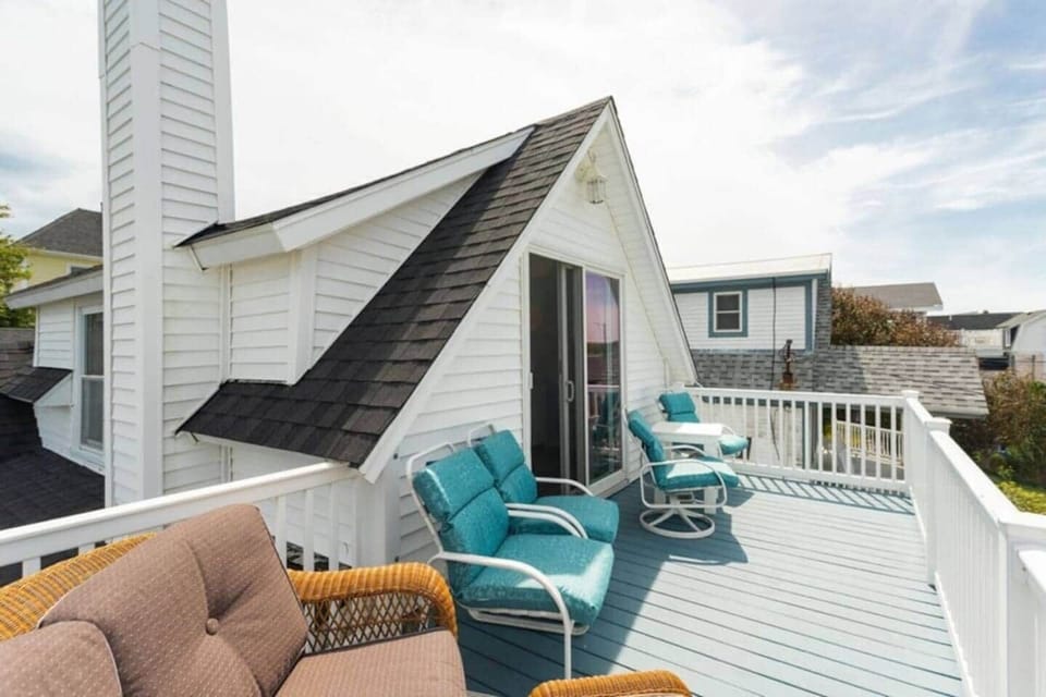 Large balcony off the primary bedroom overlooking Short Sands Beach, The Downtown Shops  &  Dinining
