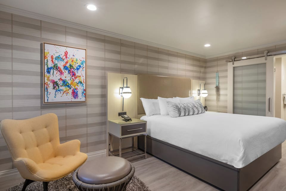 Sink into cloud-soft pillows under calming, contemporary design touches.