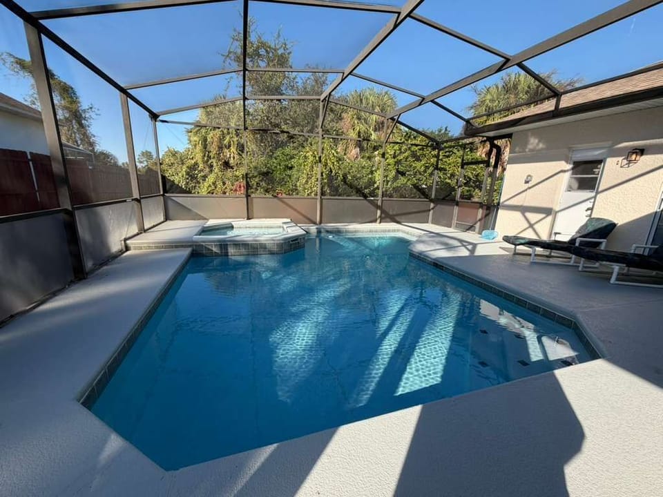 Enjoy your own private screened-in pool and spa, perfect for relaxing after a day at the parks. The sunny deck, comfortable seating, and peaceful outdoor vibe create the ideal space for family fun, morning swims, or quiet evenings.