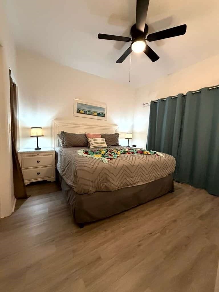 Unwind in a serene, elegantly styled bedroom designed for restful nights. Blackout curtains for a perfect sleep and cozy lights. Every detail is crafted to provide a tranquil and inviting atmosfere for your stay.