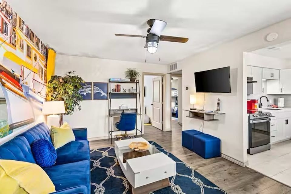 Relax in this bright and cozy living room featuring a smart TV and pull-out bed—perfect for couples, families with kids, or guests traveling with pets.